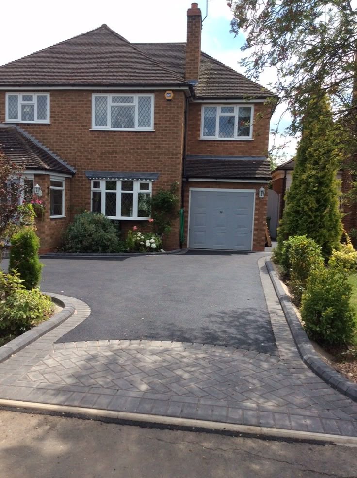 Tarmac driveway with curved block-paved edging